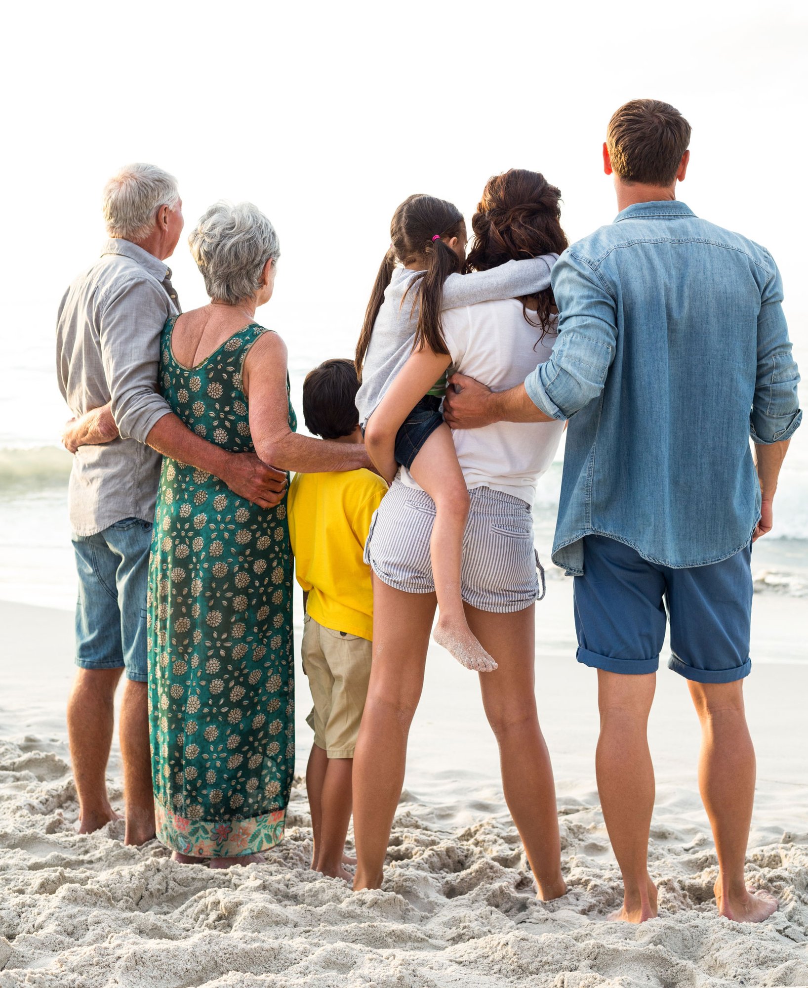 family-on-beach-looking-at-water family-on-beach-looking-at-water